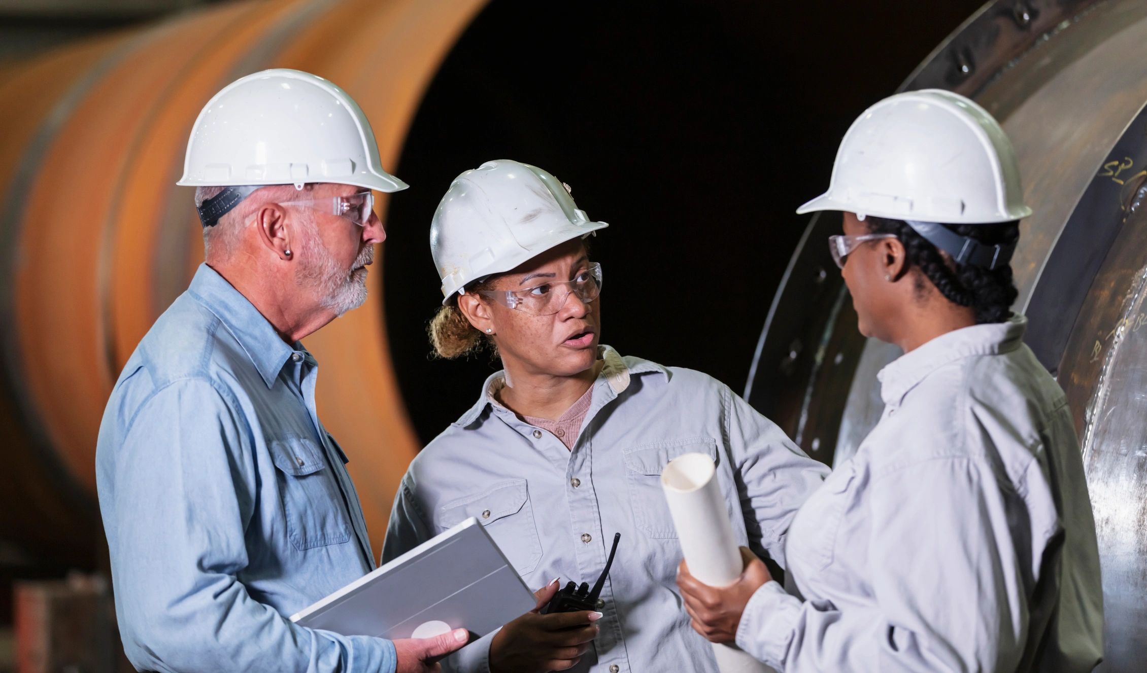 Team meeting on an industrial site, representing field and operations collaboration.