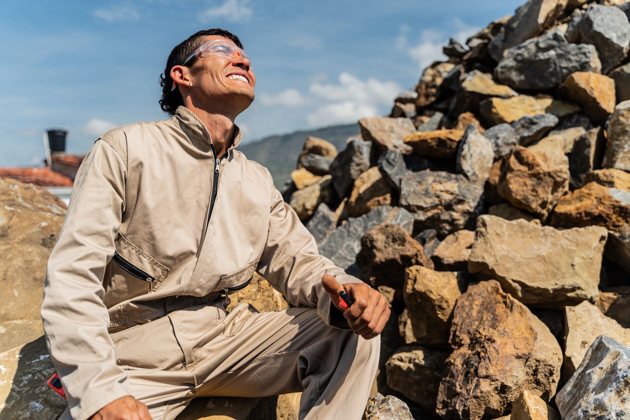 Worker at an outdoor site looking upward